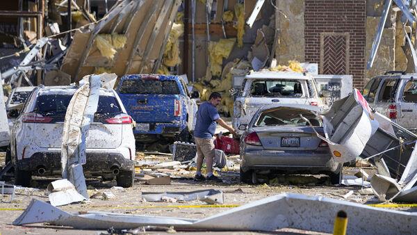 At least 18 dead as storms carve path of destruction across southern US