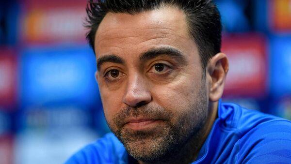 Xavi addresses the press. Xavi addresses the press.