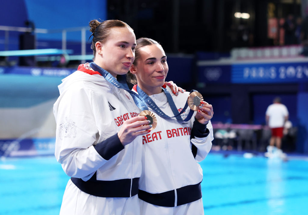 Bronze Medalists, Yasmin Harper and Scarlett Mew Jensen of Team Great Britain pose with their medals after the Medal Ceremony after competing in the Women's Synchronised 3m Springboard Final on day one of the Olympic Games